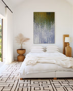 Abide In Me, John 15:5 canvas print above a low bed in a bedroom with a patterned rug