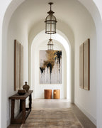 Crowned in Triumph, Revelation 3:21 canvas print at the end of an arched hallway with a hanging lantern