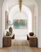 Revealed In Jesus, Romans 8:39 canvas print at the end of an arched hallway with rustic wooden benches
