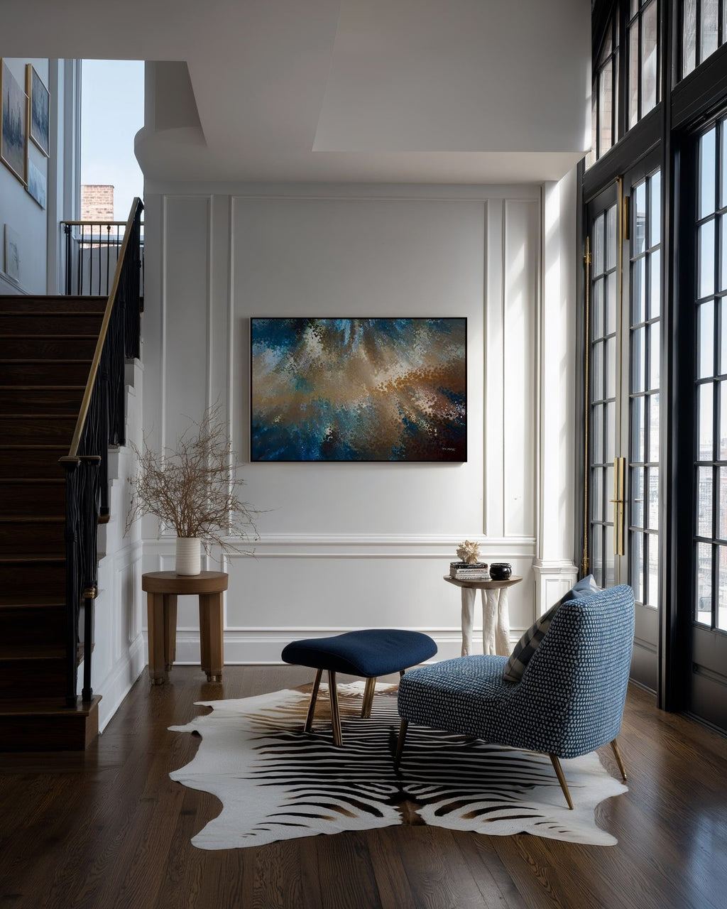 Be Fearless, 2 Timothy 1:7 canvas print on a panelled wall beside a staircase and a blue armchair