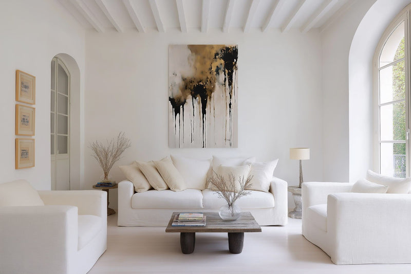 Crowned in Triumph, Revelation 3:21 canvas print above a white sofa in a wide, bright living room