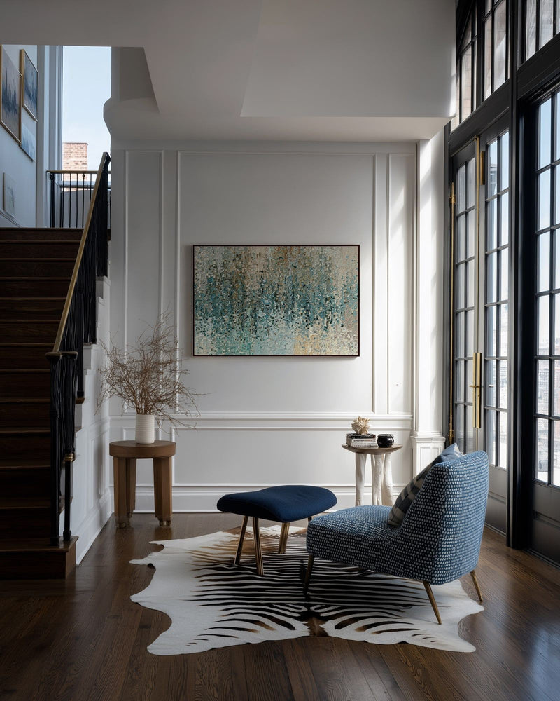 Revealed In Jesus, Romans 8:39 canvas print on a panelled wall beside a staircase and a blue armchair