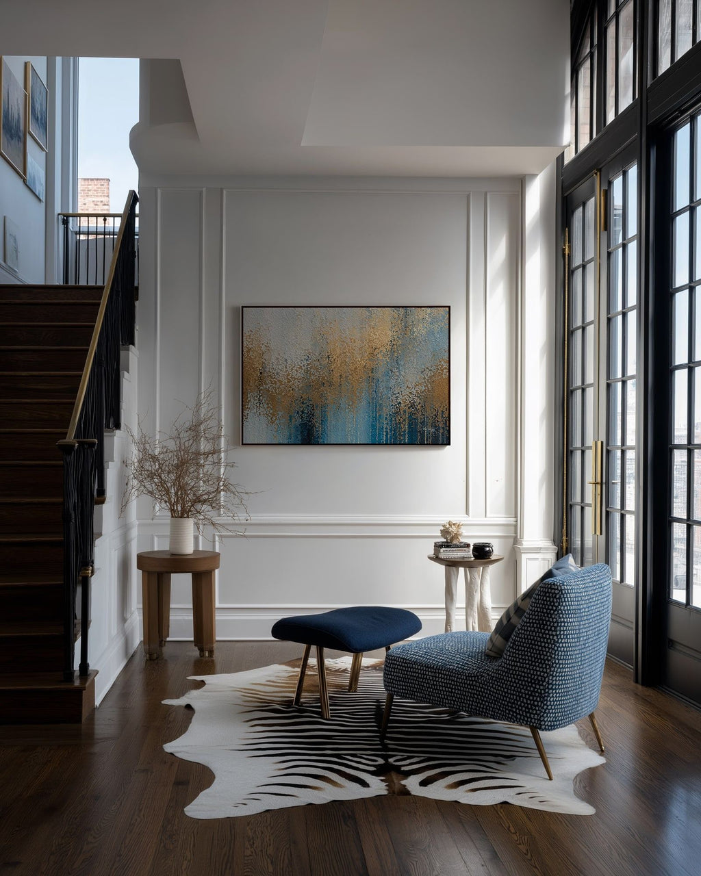 Glory Unveiled, Revelation 21:23 canvas print on a panelled wall beside a staircase and a blue armchair