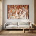 Under His Care, Isaiah 54:17 canvas print above a grey sofa in a living room